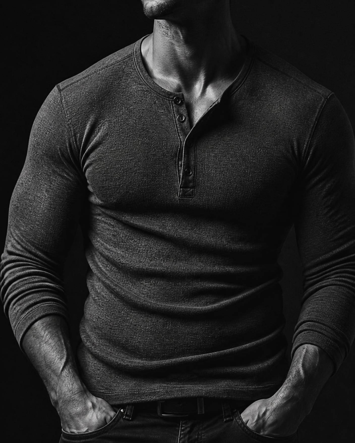 Model wearing a charcoal heavyweight henley shirt on warm stone tiles